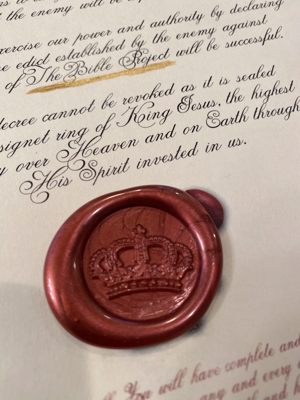 Close-up of a crown wax seal on a written decree